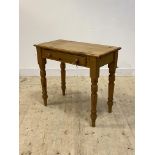 A Victorian style pine side table with frieze drawer, raised on turned supports, H77cm, W86cm,