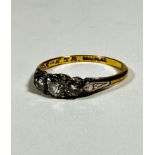 An 18ct yellow gold and platinum set three stone graduated diamond ring, mounted in claw setting (