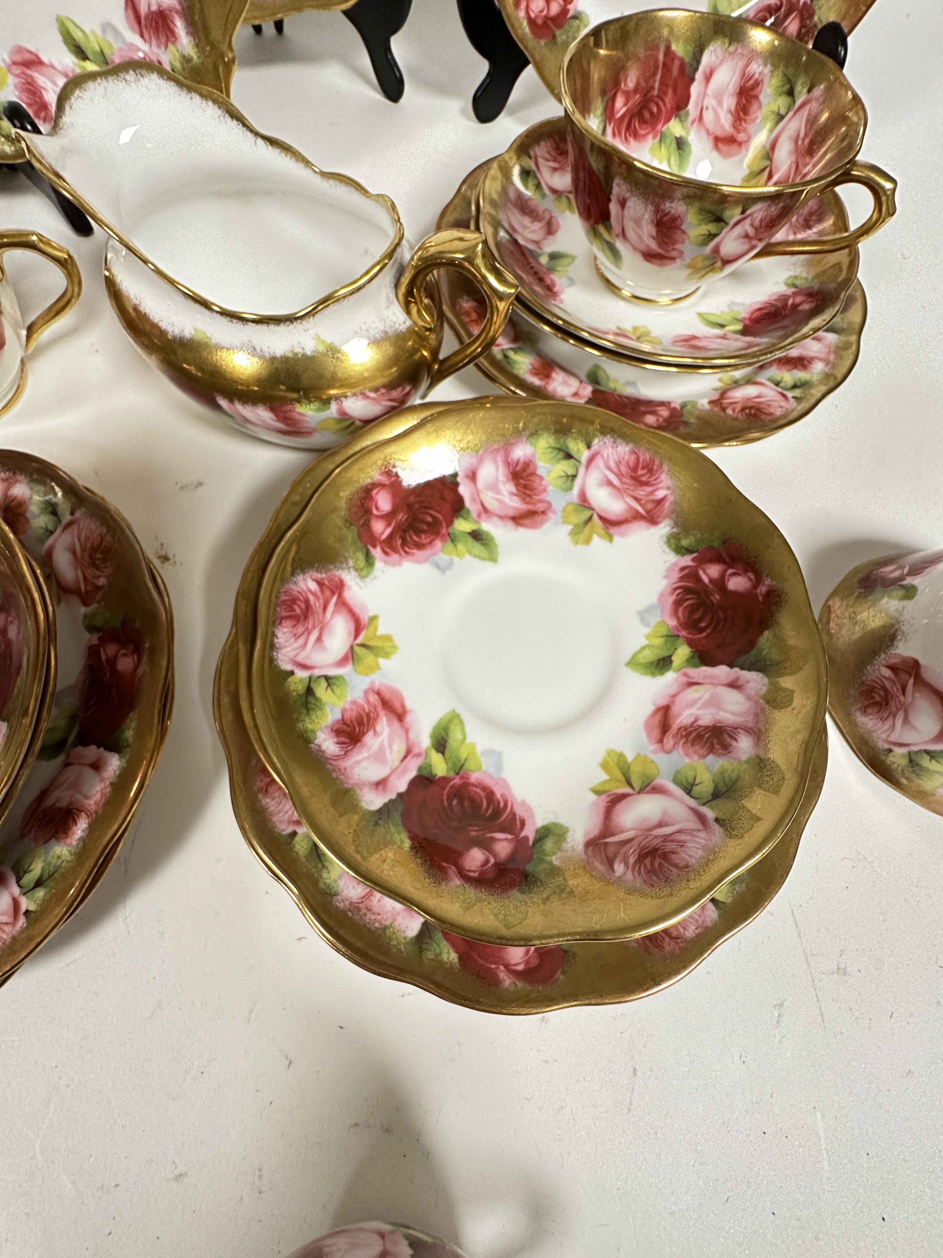 A Royal Albert pink rose and gilt bordered teaset of thirty nine pieces, including two cake - Image 8 of 9
