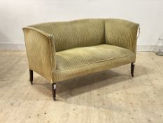 An Edwardian square back settee, upholstered in sage green striped velure, raised on square