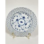 A Copenhagen circular lace bordered blue floral designed serving plate, (4cm x 25.5cm) shows no