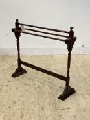 A late Victorian mahogany towel rail, on turned and sledge supports, H80cm