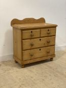 A Victorian style pine chest, ledge back over two short and two long drawers, bun supports,