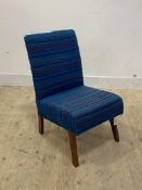 A Vintage mid century lounge chair, upholstered in blue stripped moquette, raised on splayed
