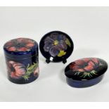 A Moorcroft cylinder container decorated with tube lined anemone design, impressed Moorcroft