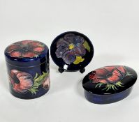 A Moorcroft cylinder container decorated with tube lined anemone design, impressed Moorcroft