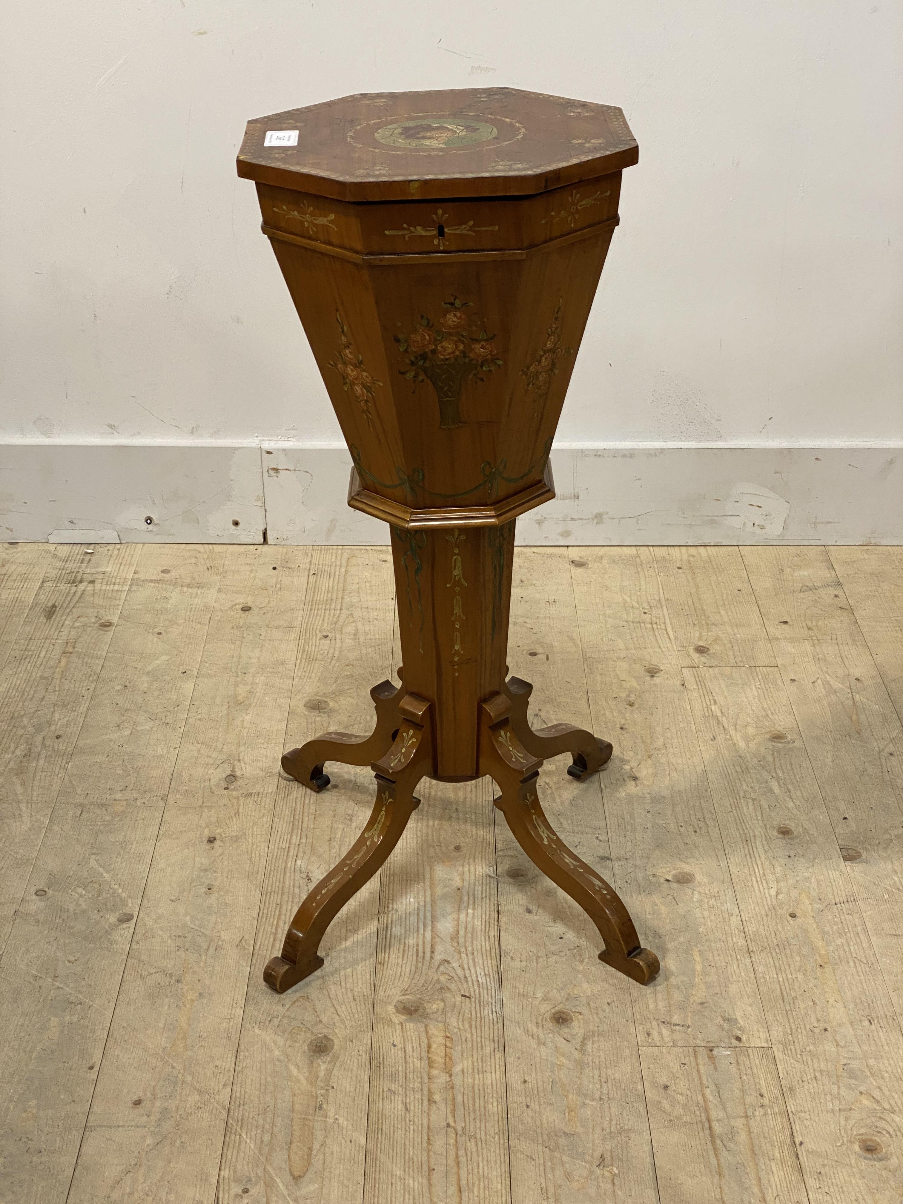 A Sheraton revival satinwood sewing table of trumpet form, early 20th century, the octagonal top