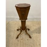 A Sheraton revival satinwood sewing table of trumpet form, early 20th century, the octagonal top