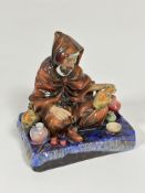 A Royal Doulton china figure The Potter, HN1473, decorated with polychrome enamels, (h 19.5cm x 17cm