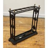 A Victorian cast iron stick stand, possibly Coalbrookdale, with six divisions and original tray,