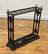 A Victorian cast iron stick stand, possibly Coalbrookdale, with six divisions and original tray,