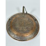 A 19thc Eastern, possibly Syrian, copper circular water container with brass spout to top, centre