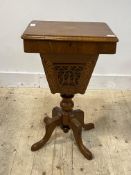 A Victorian walnut sewing table, the marquetry top lifting to reveal lift out three division tray,