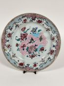 A late 18th early 19thc Chinese porcelain circular plaque decorated with famille rose design with