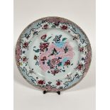 A late 18th early 19thc Chinese porcelain circular plaque decorated with famille rose design with