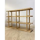 A contemporary satin birch three tier open shelf, H122cm, W185cm, D38cm