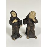 A pair of Continental Bu Pottery Merry Monk figure candle holders dressed in traditional robes (h 20