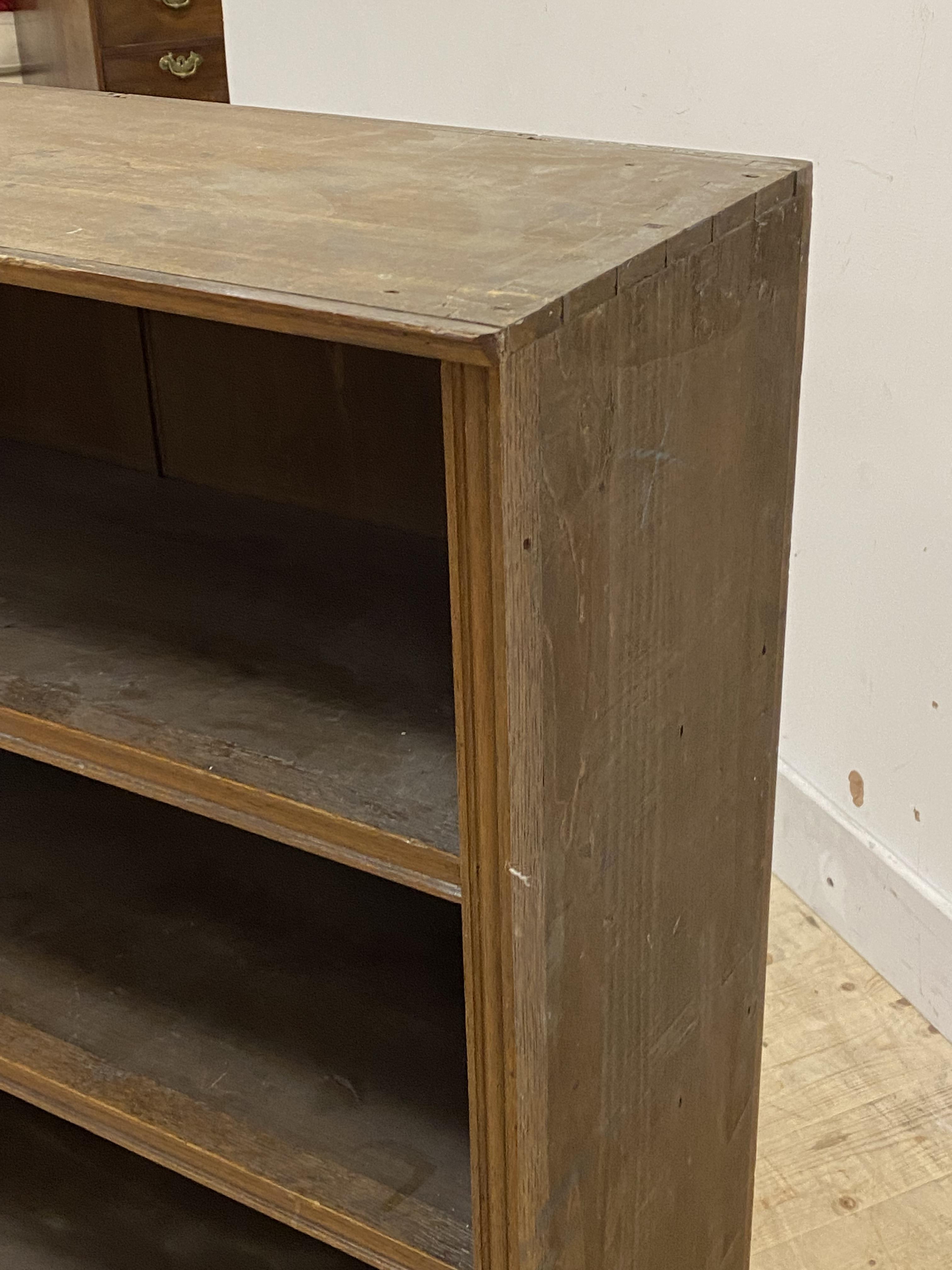 An Edwardian stained oak bookcase, with six shelves, panels to one side (formerly one section out of - Image 2 of 2