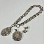 A Victorian circular and oval engraved link necklace with two circular snap open and closed
