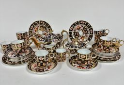 A Royal Crown Derby thirty piece coffee service complete with ten coffee cans with circular loop