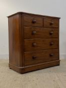 A Victorian mahogany chest fitted with two short and three long graduated drawers, with drawer to