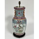 A modern Chinese famille rose style baluster vase lamp with animal figure handles to sides,