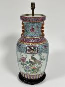 A modern Chinese famille rose style baluster vase lamp with animal figure handles to sides,