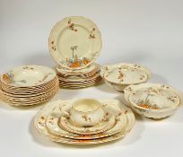 An Alfred Meakin Marigold, part dinner service comprising five side plates,two serving dishes, two