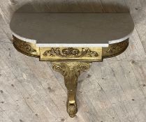 A Rococo style gilt wood and composition console table, the stepped white marble top over acanthus