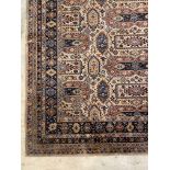 A Caucasian style rug, the ivory field of repeating geometric design, with multiple guard stripes to