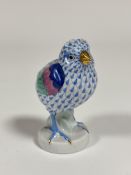 A Herend porcelain model of a Chick in a blue pattern with gilt claws and beak. ( h including base -