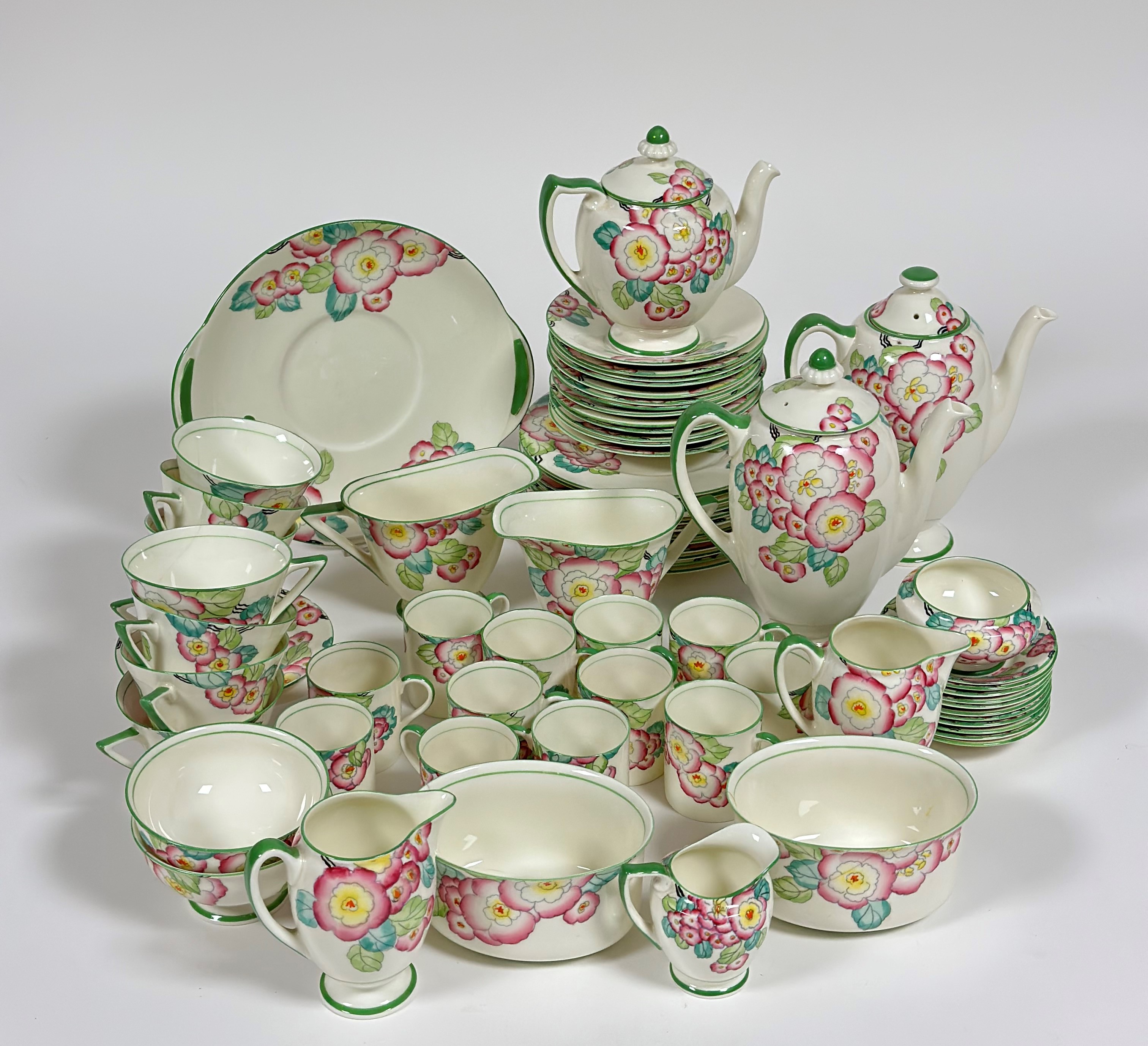 A Royal Doulton "Plaza"1920's style part tea service decorated with pink peonies and green