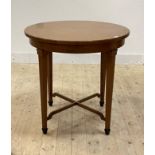 An early 20th century fruitwood centre table, the circular top raised on square tapered supports