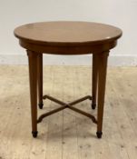 An early 20th century fruitwood centre table, the circular top raised on square tapered supports