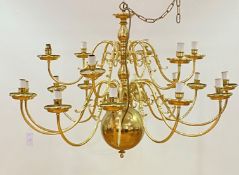 A large Dutch style brass chandelier with eighteen scrolled branches D120cm