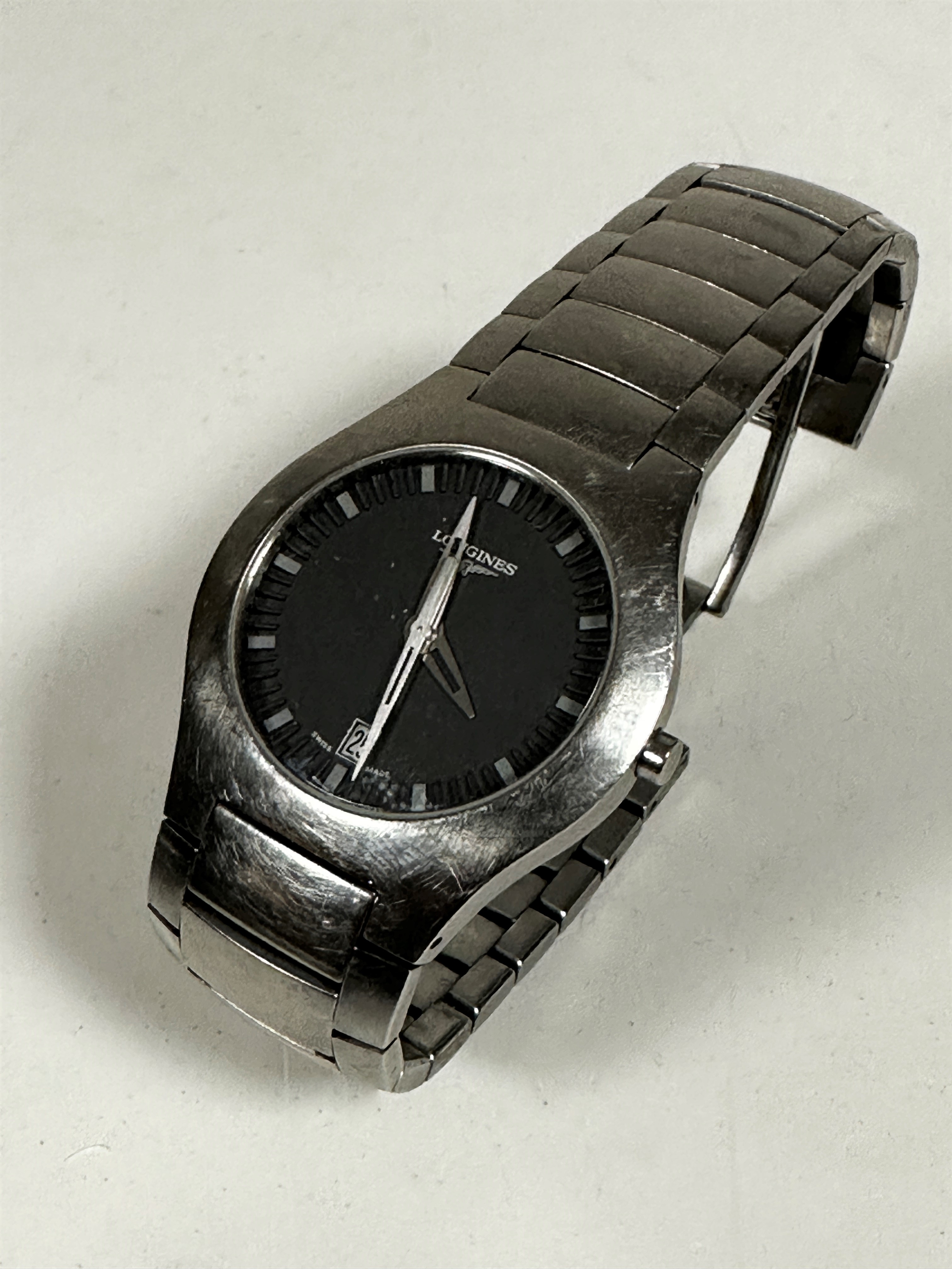 A gentleman's Longines stainless steel wrist watch with grey dial with baton hour markers and date