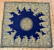 A Kashmiri felted table cover, the center lotus flowers enclosed within shaped panel with pale