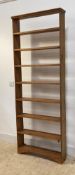 A pine open wall shelf, early 20th century, with seven shelves, H203cm, W74cm, D17cm