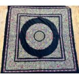 An Edwardian embroidered black felted panel, the centre square with circular medallion, with