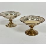 A pair of Birmingham 1924 silver pierced bonbon dishes with scrolling pierced decoration, raised