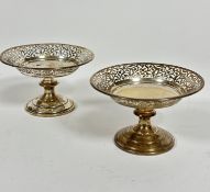 A pair of Birmingham 1924 silver pierced bonbon dishes with scrolling pierced decoration, raised