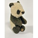 A Merry Thought Panda circa 1920s/30s in black and white mohair with stitched eyes and nose,