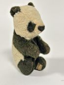 A Merry Thought Panda circa 1920s/30s in black and white mohair with stitched eyes and nose,