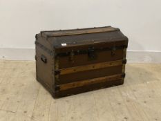 An early 20th century dome top trunk, with plain interior and carry handle to each end, H49cm,
