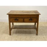 A Victorian country pine kitchen work table, scrub top over two drawers, square supports united by