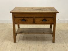 A Victorian country pine kitchen work table, scrub top over two drawers, square supports united by