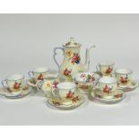 A Cauldon china 1920s fifteen piece coffee set decorated with enamelled rose and floral sprays, with