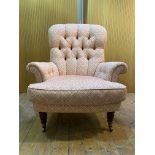 Tetrad, A Victorian style button back armchair, upholstered in a floral patterned cotton, raised