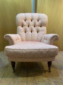 Tetrad, A Victorian style button back armchair, upholstered in a floral patterned cotton, raised