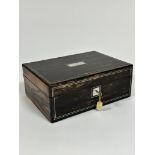 A Victorian coromandel rectangular jewellery box with mother of pearl inlaid rectangular boarded